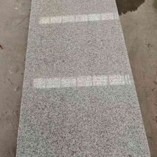 盘锦芝麻白光面毛板